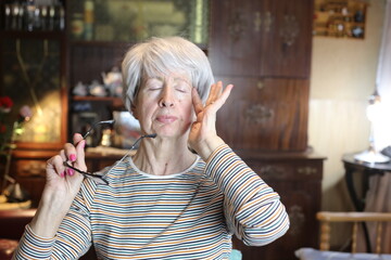 Senior woman experimenting vision problems 