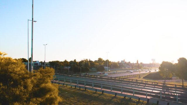 bicycle driving at sunrise over bridge over highway