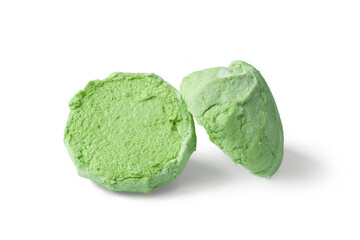 Marshmallow on a white background. Divided green marshmallow. Sweet dessert