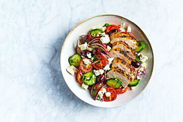 Greek salad with chicken. Top view - 562217550