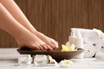 Woman undergoing spa pedicure treatment in salon, closeup