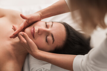 Fototapeta na wymiar Masseuse doing massage to client