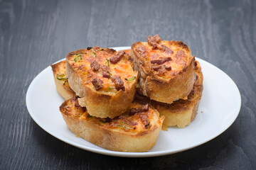 Toastet bread and eggs for breakfast and sausage with cheese on top