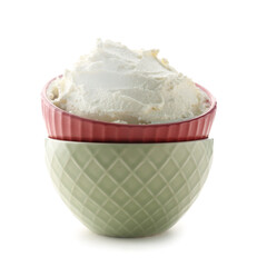 Bowls with tasty cream cheese on white background