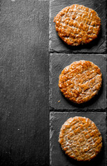 Cutlets on stone supports.