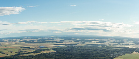The landscape of the land of Lithuania from a bird's eye view, wide angle, visible forests and plains