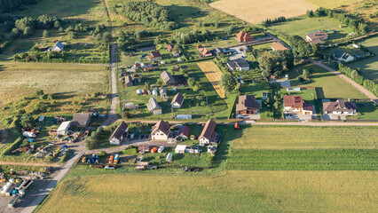 View from hot air balloon, flying above Lithuanian rural countryside. Air travel and transportation, beautiful nature landscape shot from aerial perspective