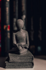 Figurine with a book