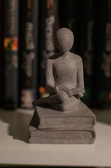 Figurine with a book