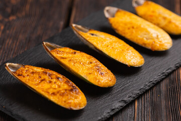Baked mussels with cheese sesame seeds in shells - asian food