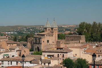 Fototapeta na wymiar Segovia, España. April 29, 2022: Walls of Toledo and alpha tower with urban landscape.