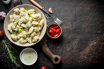Dumplings with spices, garlic, sour cream and tomato paste.