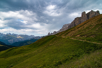 Fototapeta na wymiar Iconic hiking trail in the Italian Alps, Dolomites. Hiking and mountaineering route tourism in Italy. Lonely mountain path.