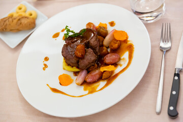 Delicious fried beef tenderloin flavored with fragrant rosemary served with mashed potatoes, baked yam slices, chestnuts and shallots. Typical Italian dish