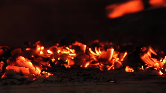 Grill Shovel Moving Burning Charcoal from Fire. 4K Resolution.
