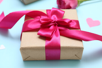 Gift for Valentine's Day celebration on color background, closeup