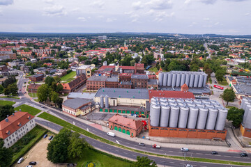 Brewery factory in Tychy, Poland from an aerial view on a beautiful sunny day. A giant beer brewing industry located in the Silesian Voivodeship.