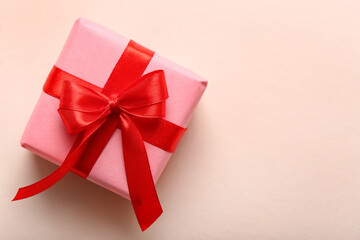 Beautiful gift with red ribbon on white background. Valentine's Day celebration