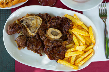 Ossobuco. Cross-cut veal shanks braised with potatoes. Italian cuisine