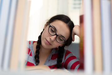 Young female Student doing complicated homework online