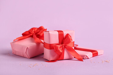 Beautiful gift boxes for Valentine's Day celebration on pink background