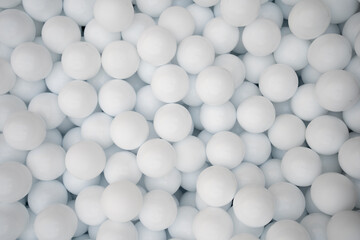Many white plastic balls for dry pool.