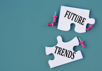 Words FUTURE TRENDS. Concept on mosaic puzzles on a dark green background