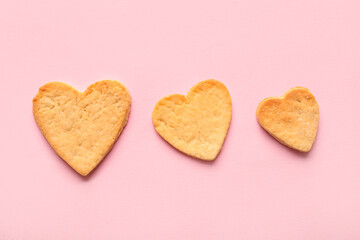 Obraz na płótnie Canvas Sweet heart shaped cookies on pink background. Valentines Day celebration