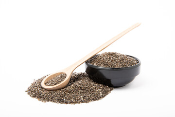 Chia seeds in bowl and wooden spoon isolated on white background. SUPERFOOD