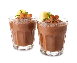 Glasses of chocolate pudding with almond, mint and banana slice isolated on white background