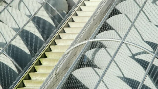 Closeup of grey turning metal screw pumps to pump water from low to high. Also known as Archimedes screw pump or water screw