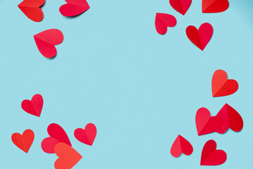 Frame made of paper hearts on blue background. Valentines Day celebration
