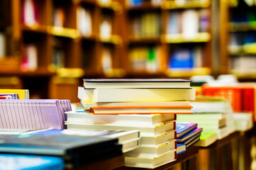 Blurred bookstore with books on tables and shelves. Education, school, study, reading fiction concept © svetlanais