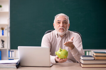 Old male teacher in retirement concept