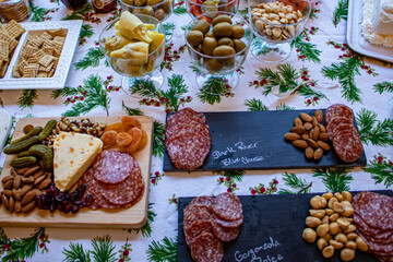 Charcuterie Meats, Cheeses, Nuts, and Other Snacks on Display at a Christmas Holiday Party