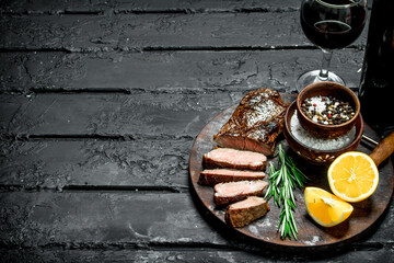 Grilled beef steak with red wine.