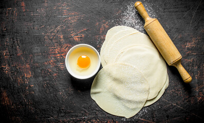 Rolled out dough for making raw gedza dumplings.