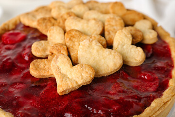 Sweet strawberry pie with cookie hearts for Valentine's day on light background