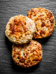 Three cooked cutlets.