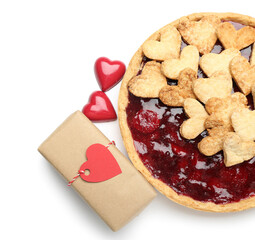 Sweet strawberry pie with cookie hearts and gift for Valentine's day isolated on white background