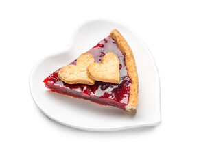 Heart-shaped plate with piece of sweet strawberry pie and cookie hearts for Valentine's day isolated on white background