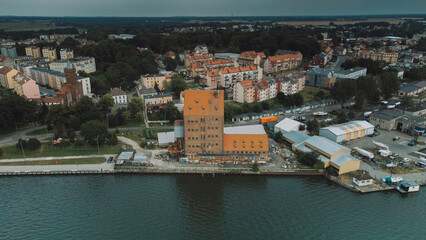 Fototapeta na wymiar Aerial view of lake with facilities and boats.