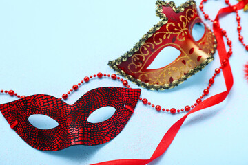 Carnival masks with beads on blue background