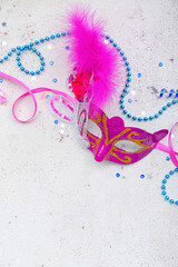 Carnival mask with beads and sequins on light background