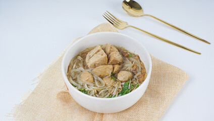 Indonesian Famous Foodstreet Bakso or Meatballs in white bowl. selective focus