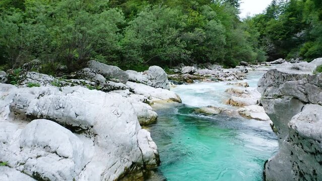 Flying Above Idyllic Emerald Soča River, Stream that Floats Through Small Soča Gorge Located in Bovec Surrounded With Huge Stones, Rocks, River Gorge, Forest.