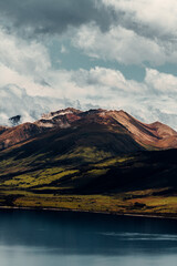 Fototapeta na wymiar Vertical Shot of Mountains and Lake in New Zealand Nature Landscape 