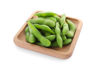 Wooden plate with green edamame pods on white background