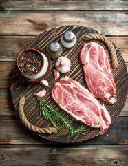 Raw steaks from juicy pork.