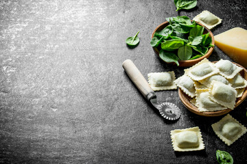 Ravioli raw with Parmesan and spinach.